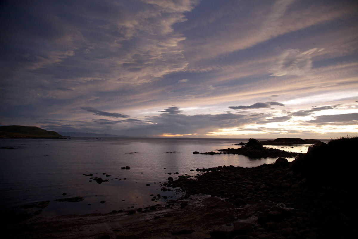 Pene Rock and Matariki Island at sunset